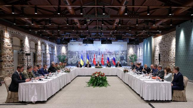 Turkish Foreign Minister Hakan Fidan, centre, presides over talks between the Ukrainian delegation, left, and the Russian delegation, right, at peace talks in Istanbul. Picture: AFP / Turkish Foreign Ministry