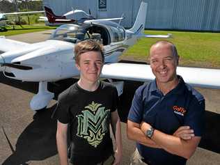 WINGS: Adain Harris, 15, has won a learn to fly scholarship offered up by GoFly Aviation. Chief Pilot and owner Damian Wills congratulates Adain. Picture: Patrick Woods