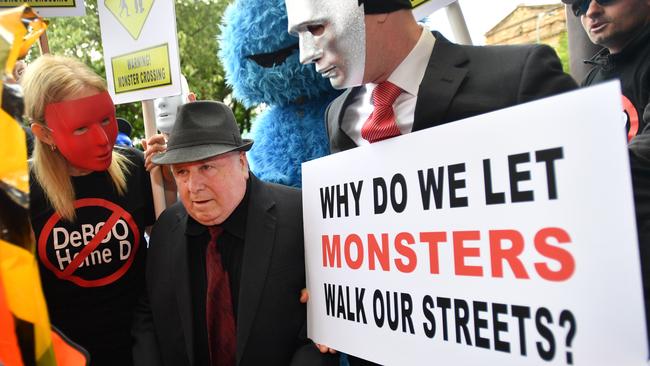 Vivian Frederick Deboo confronted by his victims and their supporters in November 2018. Picture: David Mariuz/AAP