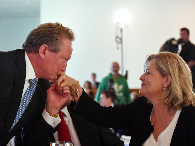 Philanthropist Andrew 'Twiggy' Forrest kisses the hand of wife Nicola, who formed the foundation to end modern slavery together in 2010. Picture: AAP Image/Mick Tsikas