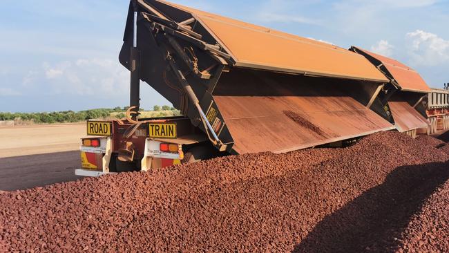 A shipment of iron ore being delivered at the port of Darwin.