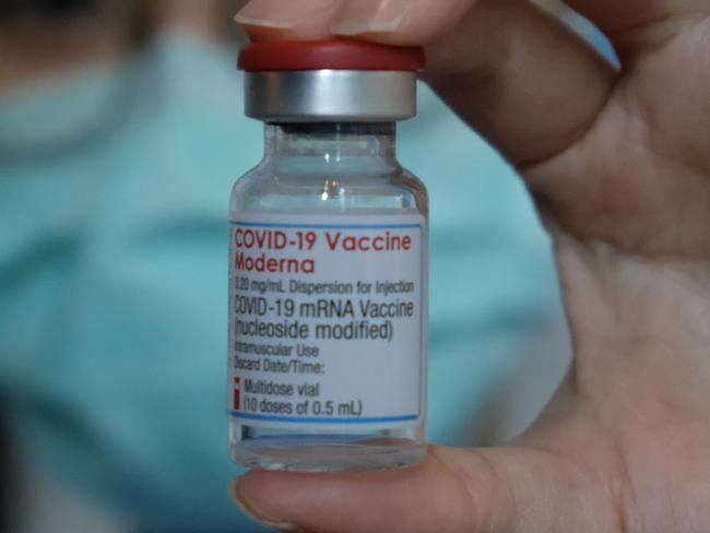 A medical worker displays a Moderna vaccine gainst the Covid-19 coronavirus at Taipei Tzu Chi Hospital in New Taipei City on June 9, 2021. (Photo by Sam Yeh / AFP)