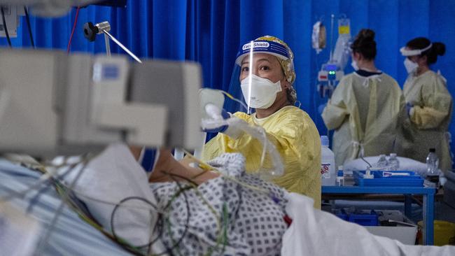 A nurse works on a patient in St George’s Hospital ICU in London. Picture: Getty Images.