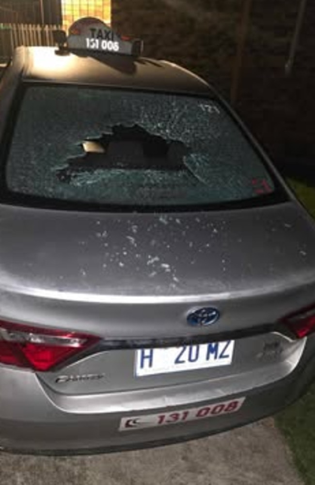 A friend's taxi parked at Ali's property had its rear windshield smashed, dents placed around the car and side mirrors kicked in. Picture: supplied