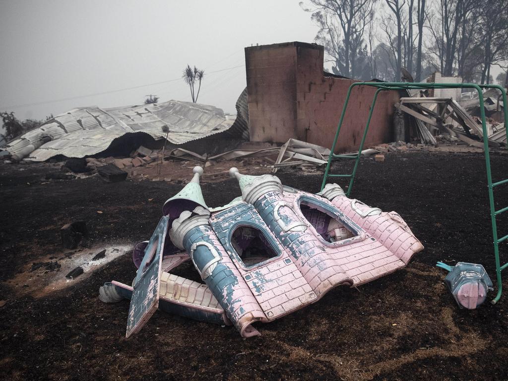 A melted children's play castle in the backyard of a burnt property in Cobargo. Picture: Gary Ramage