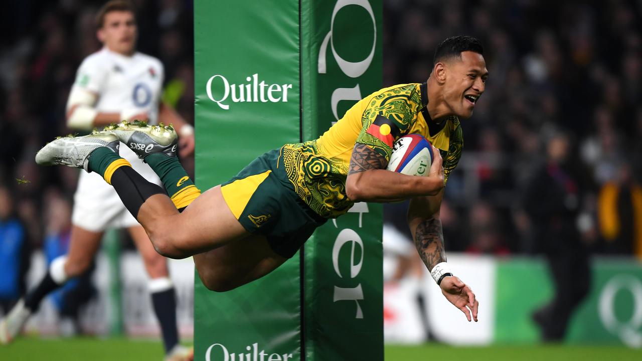 Israel Folau of Australia scores at Twickenham Stadium.