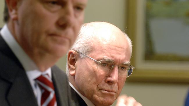 Former Prime Minister John Howard with former Treasurer Peter Costello at a joint press conference.