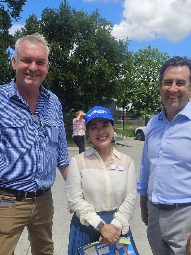 LNP MPs Lachlan Millar and Mark Robinson ditched parliament on Wednesday to help Inala by-election candidate Trang Yen (centre) campaign on a pre-poll station.