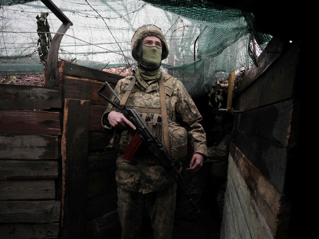 A Ukrainian serviceman stands at his position on the frontline with Russian-backed separatists near the small city of Marinka, Donetsk region, on April 20. Picture: Aleksey Filippov/AFP