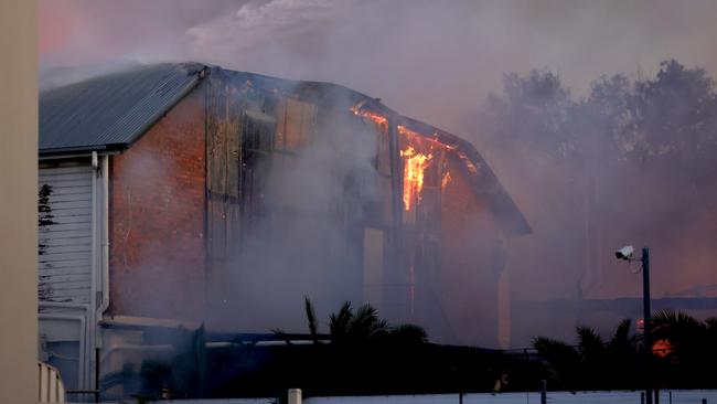 Multiple fire units spray water on buildings on fire in Hubert St, Gabba - on Wednesday 25th of September - Photo Steve Pohlner