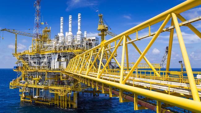 Oil and Gas production platform in blue sky located at the gulf of Thailand.