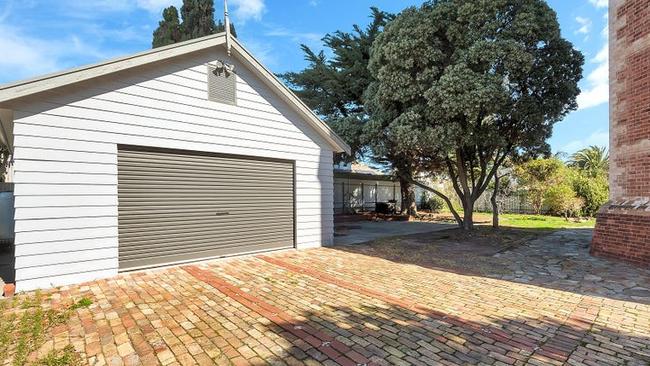 The garage with room for further off-street parking.