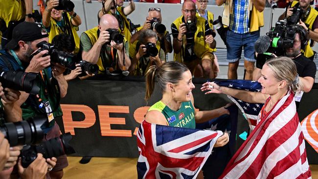 Nina Kennedy celebrates with USA's Katie Moon as they decide to share the gold medal after recording the same height in the women's pole vault final. Picture: Kirill Kudryavtsev/AFP