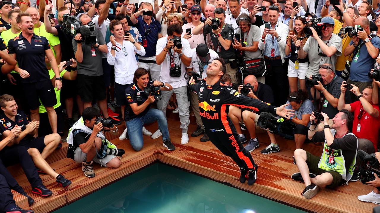 Daniel Ricciardo dives into Monaco’s swimming pool after winning in 2018. (Photo by Dan Istitene/Getty Images)