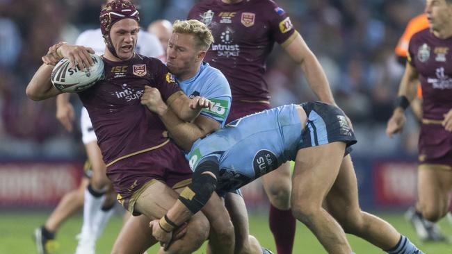 Kalyn Ponga runs into the Blues’ defence at ANZ Stadium last night. Picture: AAP