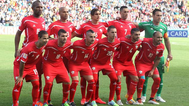 NEWCASTLE, AUSTRALIA - JANUARY 12: Palestine players line up before the match during the 2015 Asian Cup match between Japan and Palestine at Hunter Stadium on January 12, 2015 in Newcastle, Australia. (Photo by Tony Feder/Getty Images)