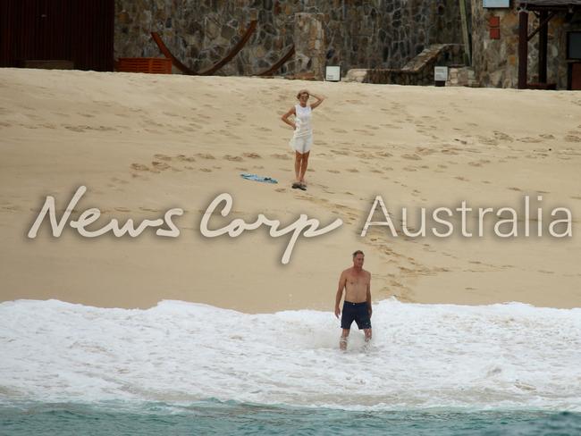 Julie Bishop watches on as her partner David Panton goes for a dip in the ocean at the One &amp; Only Resort in Pamilla Mexico. Picture: News Corp Australia