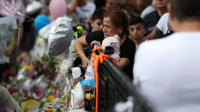 An outpouring of grief as the Abdallah family hold a memorial at the site in Oatlands where their three children and their cousin were killed. Picture: Jonathan Ng