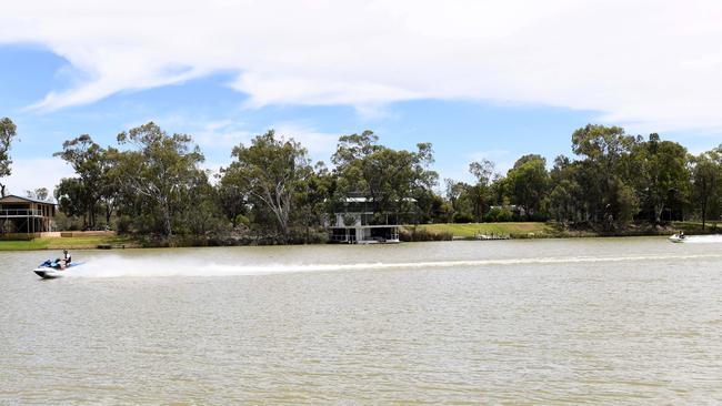 Two jetskis speed past the area where the accident happened. Picture: Tricia Watkinson