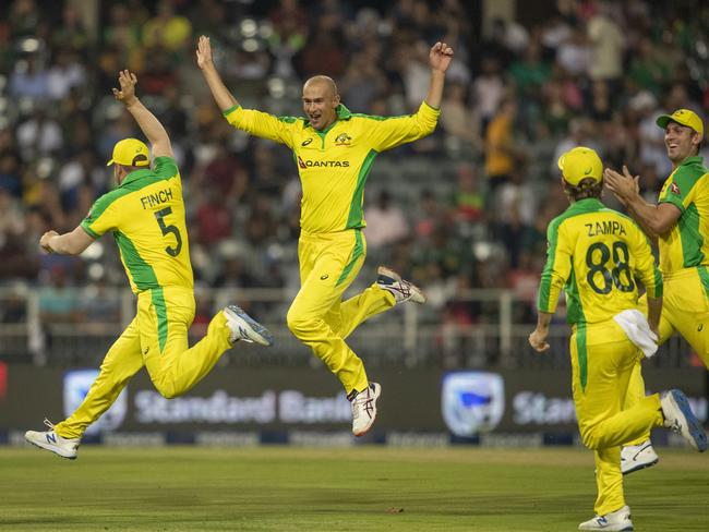 Australia's bowler Ashton Agar, second from left, celebrates with teammates after dismissing South Africa's batsman Dale Steyn. Picture: AP Photo/Themba Hadebe