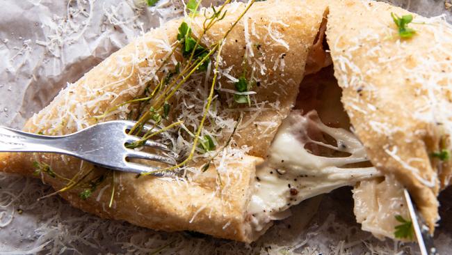 The irresistible panzerotto mortadella and pecorino is a fried pizza dough folded and filled with mortadella, buffalo mozzarella and Sardinian pecorino cheese. Picture: Monique Harmer