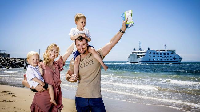 Chloe and Grant Hutcheon, with children Thomas and Will, line up for a ferry ride. Picture: Nicole Cleary