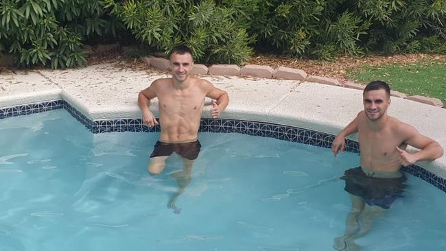 Jason Moloney and his brother take a dip after a heavy session.