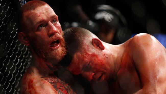 Conor McGregor (L) and Nate Diaz battle during their welterweight rematch at UFC 202.