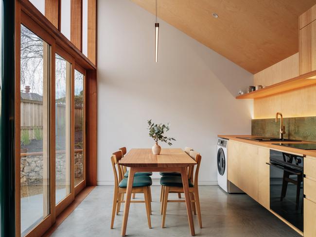 Little Brick Cottage’s light-filled modern extension which incorporates the property’s stylish, compact living and kitchen space. Picture: Adam Gibson