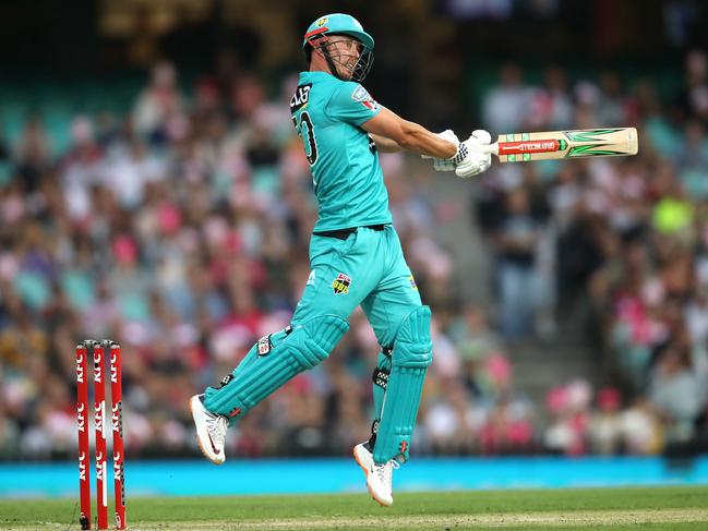 Heat's Chris Lynn smashes a boundary during the Big Bash match between the Sydney Sixers and Brisbane Heat at the SCG. Picture. Phil Hillyard