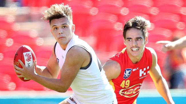 Dyson Budarick (left) in action for the Southport Sharks in a NEAFL game against the Gold Coast Suns reserves. Picture: Richard Gosling