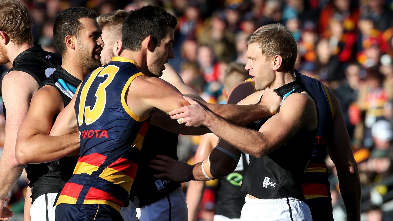Taylor Walker and Kane Cornes have squared off once again. Picture: Simon Cross