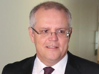 Treasurer Scott Morrison walks to Ch9 studios at Parliament House in Canberra this morning to be interviewed by Laurie Oaks. Picture: Ray Strange.