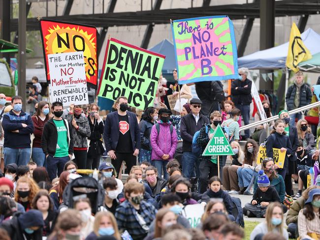 Signs of the times at the Adelaide rally. Picture: NCA NewsWire / David Mariuz