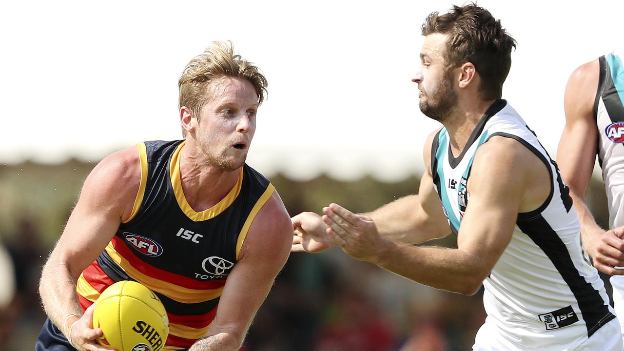 Crows co-captain Rory Sloane gets past Port’s Sam Gray during the JLT Series. Picture SARAH REED