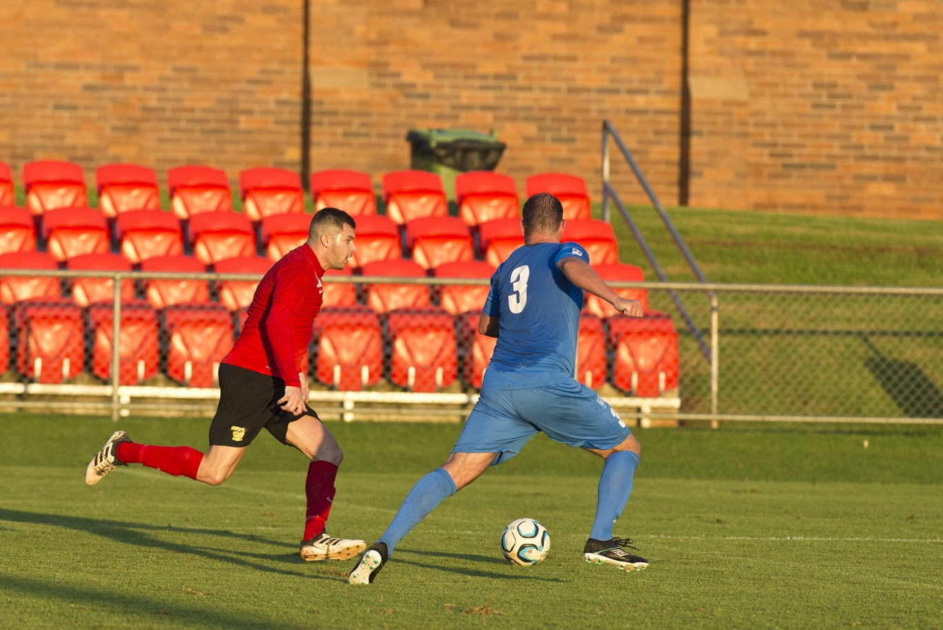 Daniel Bailey (left) of Sunshine Coast Fire goes against Paul Mikula of South West Queensland Thunder in NPL Queensland men round nine football at Clive Berghofer Stadium, Saturday, March 30, 2019. Picture: Kevin Farmer