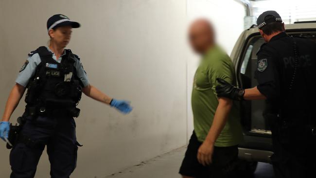 Jason Bishop is taken into Raymond Terrace police station to be charged. Picture: NSW Police.