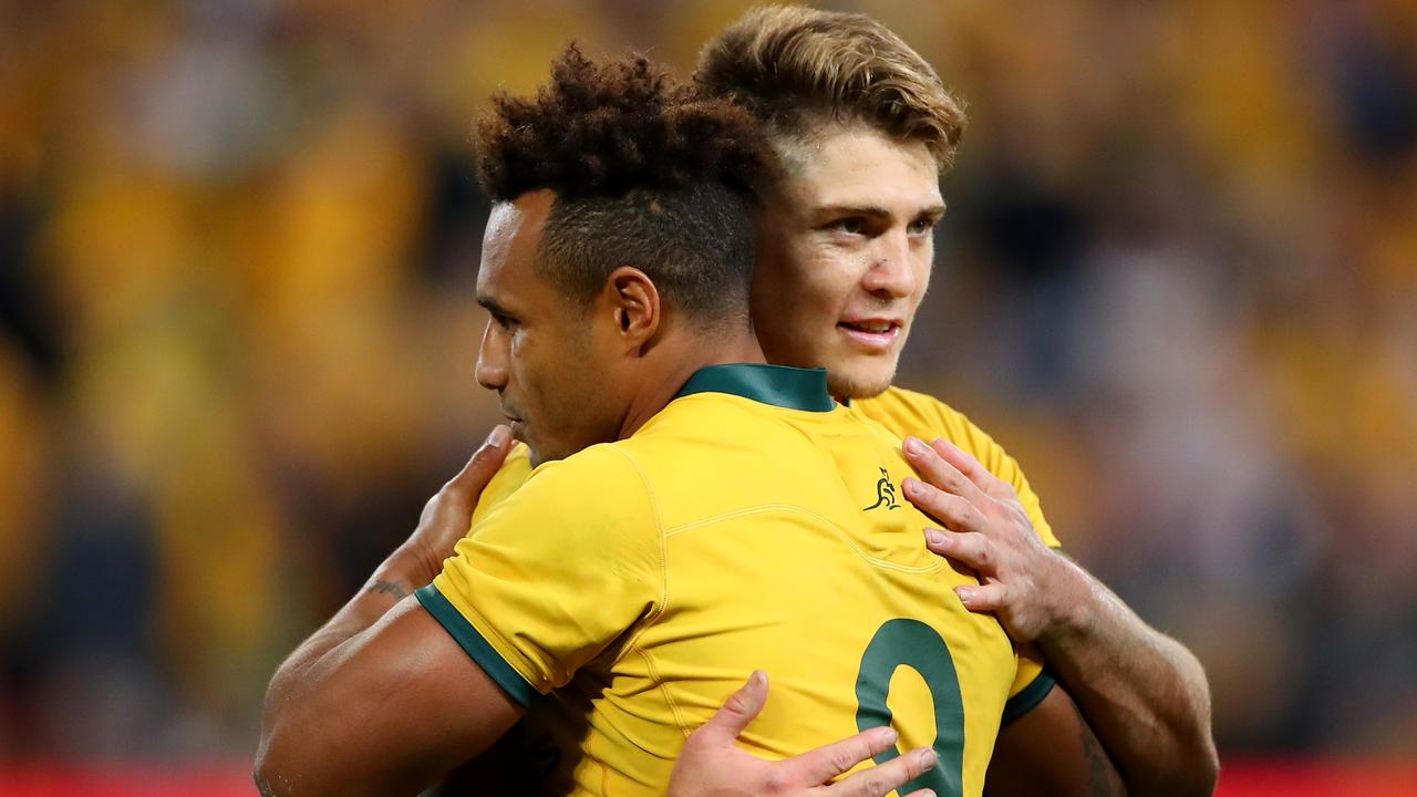 Will Genia and James O'Connor of the Wallabies embrace.