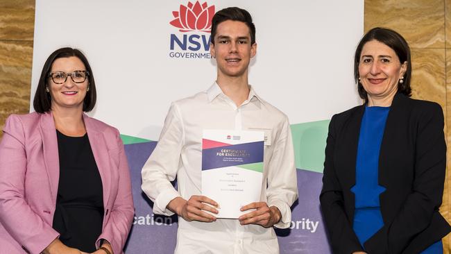 Brendan Mitchell of St Patrick's Marist College, Dundas, came first in the state in Mathematics Standard 2. Pictured with Education Minister Sarah Mitchell and NSW Premier Gladys Berejiklian. Picture: Anna Warr