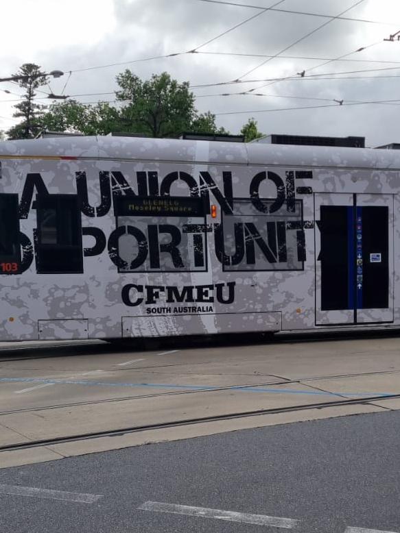 The Transport Department says it was not made aware of CFMEU advertising installed on the exterior of an Adelaide Metro tram. Picture: Supplied