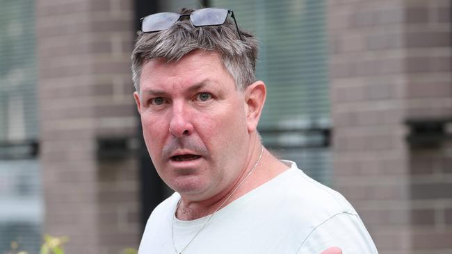 Scott Minigle spoke to reporters outside court, where he appeared for the first time over an alleged domestic violence incident minutes prior to a woman falling to her death. Picture: NCA NewsWire/Damian Shaw