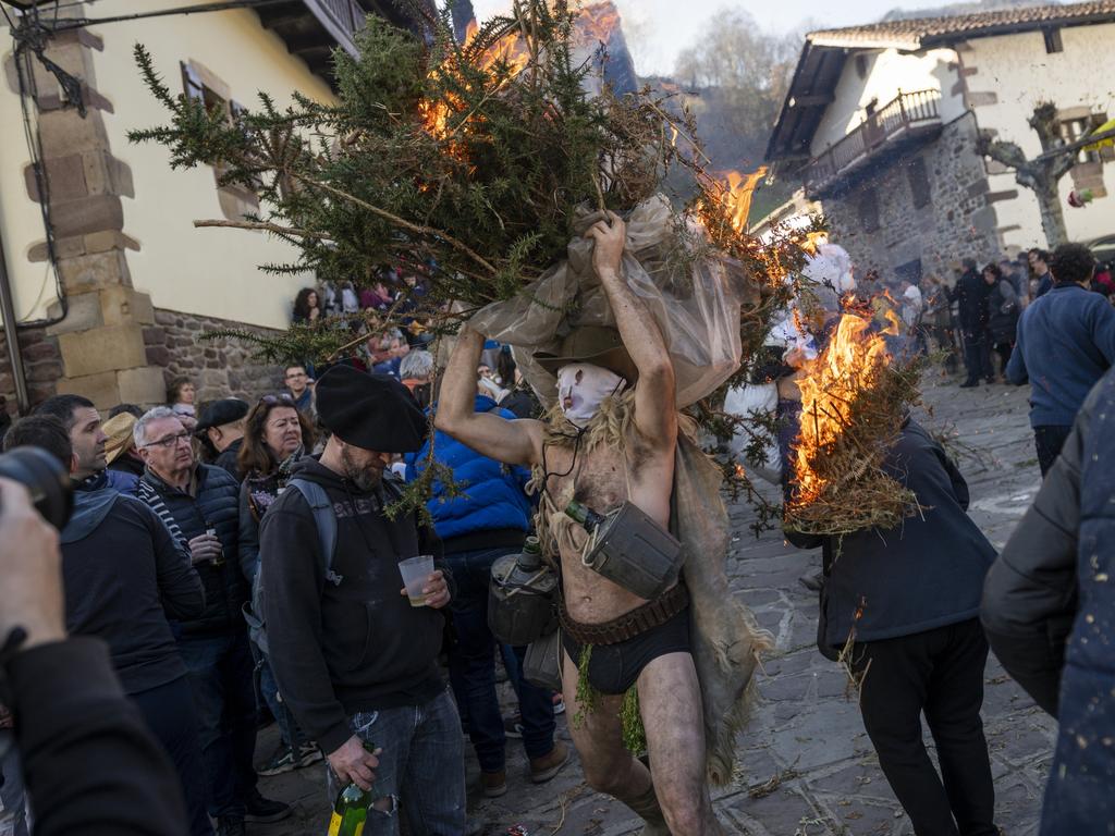 Masked performers celebrate the ancient Ituren and Zubieta carnival in Navarra, Spain, ringing cow bells to ward off evil spirits and herald a prosperous harvest. Picture: Gari Garaialde/Getty Images