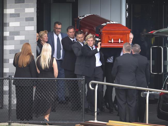 The coffin of Shane Warne is carried out by his son Jackson. Picture: David Caird