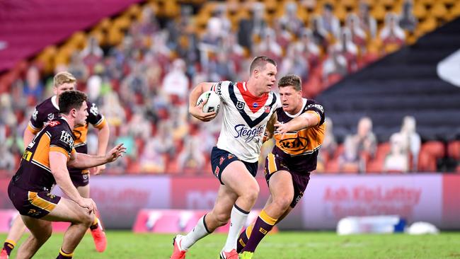 Lindsay Collins of the Roosters breaks away from the defence during the round four NRL match between the Brisbane Broncos and the Sydney Roosters.(Photo by Bradley Kanaris/Getty Images)