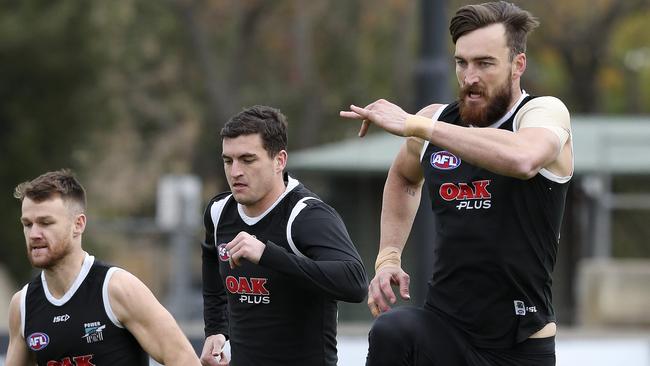 Port Adelaide’s Robbie Gray, Tom Rockliff and Charlie Dixon train at Alberton. Picture: Sarah Reed