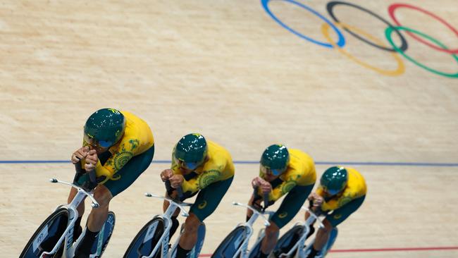 Australia's Oliver Bleddyn, Australia's Sam Welsford, Australia's Conor Leahy and Australia's Kelland O'brien compete to break the world recors during the men's track cycling team pursuit first round of the Paris 2024 Olympic Games at the Saint-Quentin-en-Yvelines National Velodrome in Montigny-le-Bretonneux, south-west of Paris, on August 6, 2024. (Photo by Thomas SAMSON / AFP)