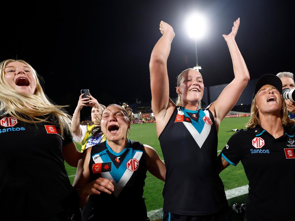 Matilda Scholz of the Power celebrates with teammates after the semi-final. Picture: Michael Willson/AFL Photos via Getty Images.