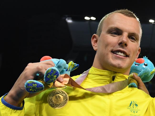 (L-R) Kyle Chalmers, Elijah Winnington, Alexander Graham, Mack Horton of Australia during the medal ceremony for the MenÕs 4x200m Freestyle Relay Final on day four of swimming competition at the XXI Commonwealth Games at Gold Coast Aquatic Centre on the Gold Coast, Australia, Sunday, April 8, 2018. (AAP Image/Dave Hunt) NO ARCHIVING, EDITORIAL USE ONLY