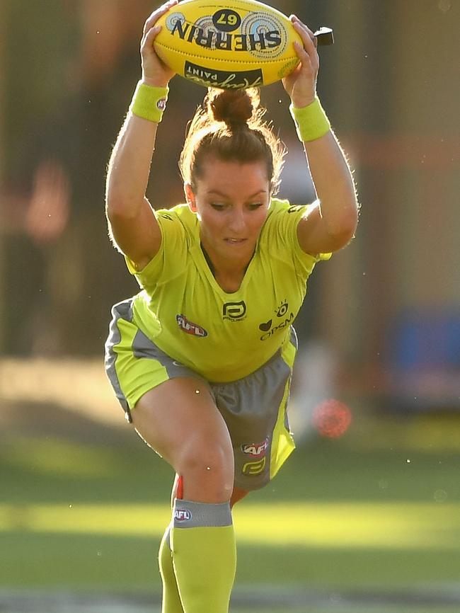 Eleni Glouftsis bounces the ball during the round ten AFL match between the Melbourne Demons and the Gold Coast Suns at Traeger Park. Picture: Quinn Rooney/Getty Images