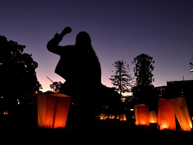 A protestor is seen during the candlelight vigil to protest against the deaths in custody of Aboriginal and Torres Strait Islander people. Picture: Darren England